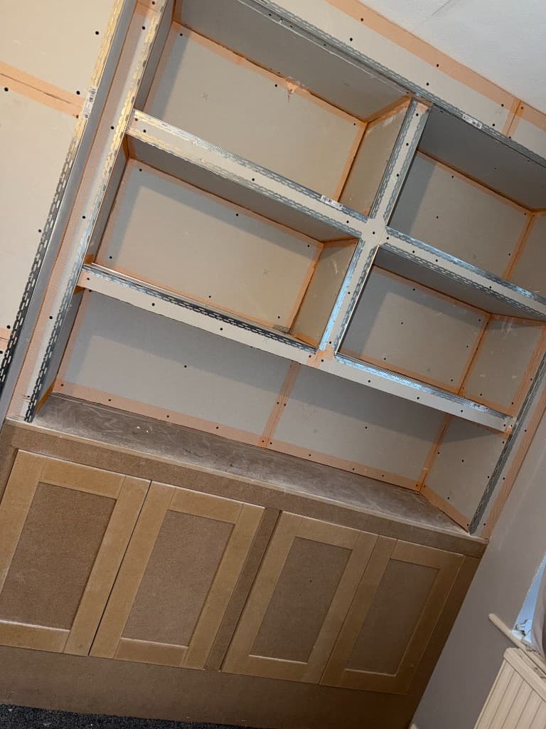 Wood effect media wall with Sky TV and fireplace