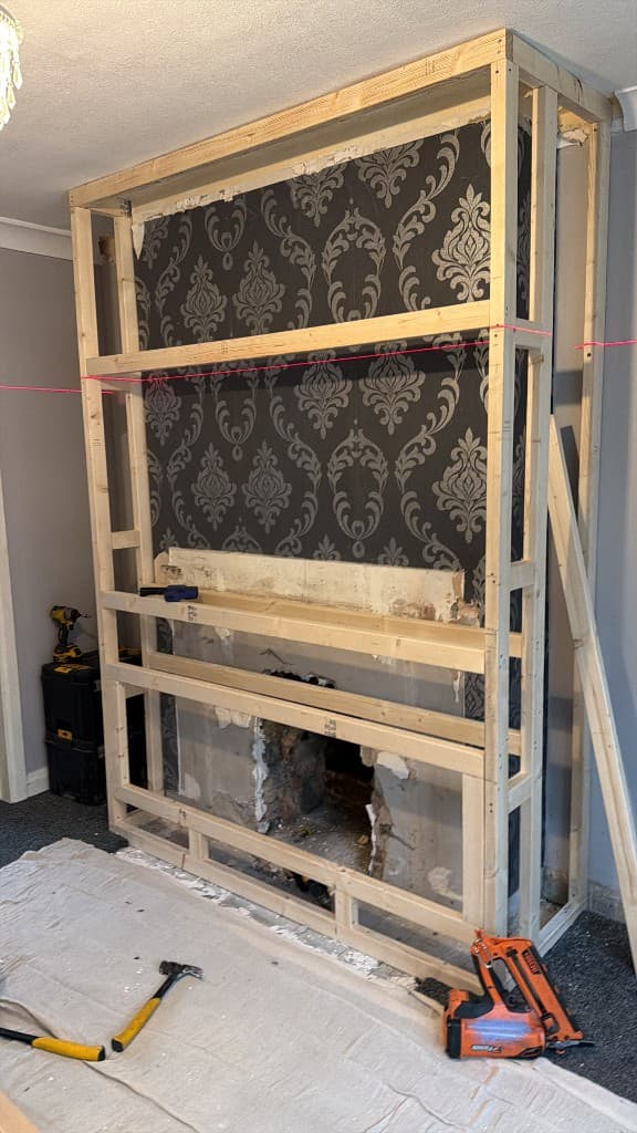 Luxury wood panel media wall with blue fire